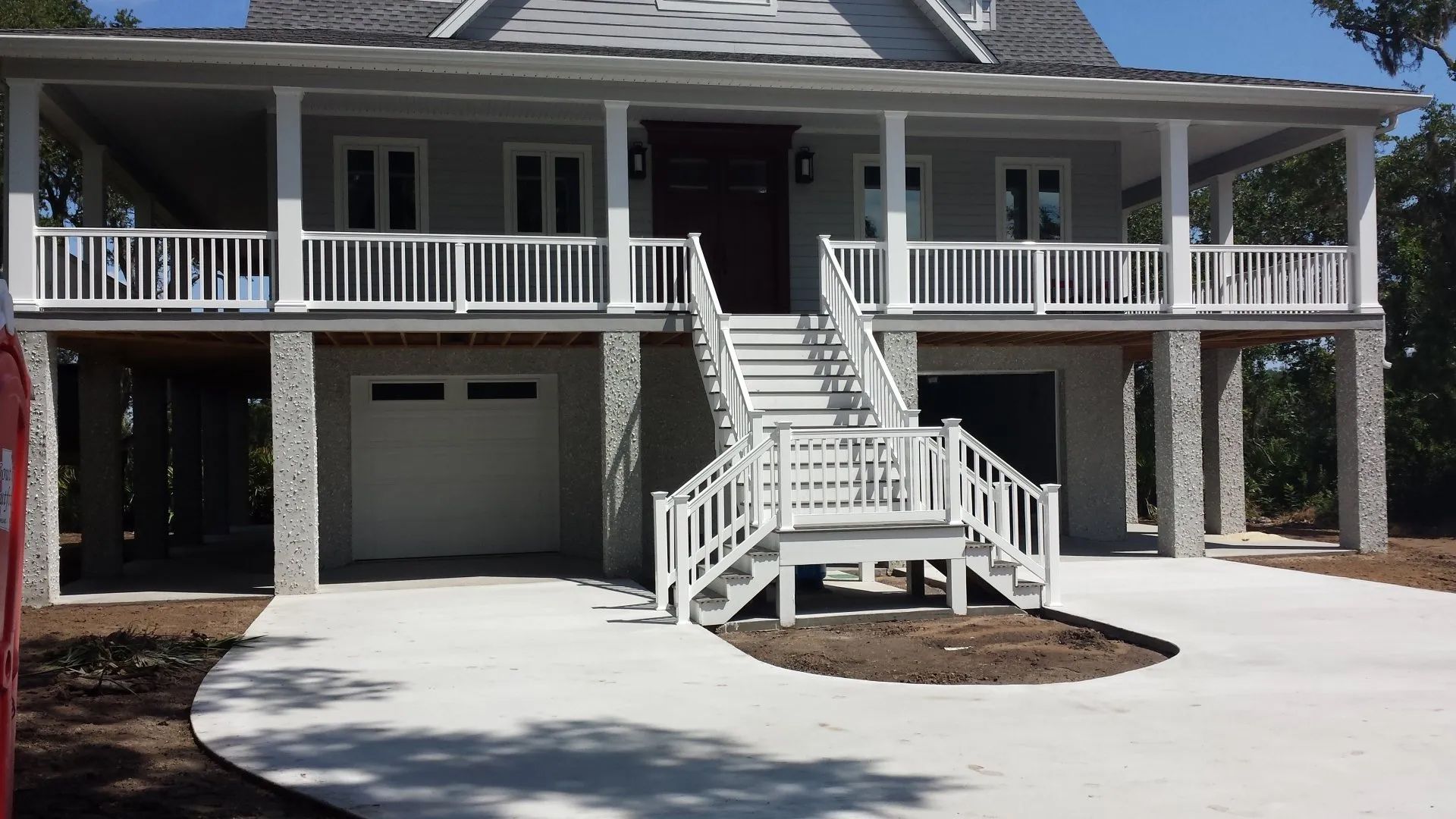 a large house with stairs leading up to the front door