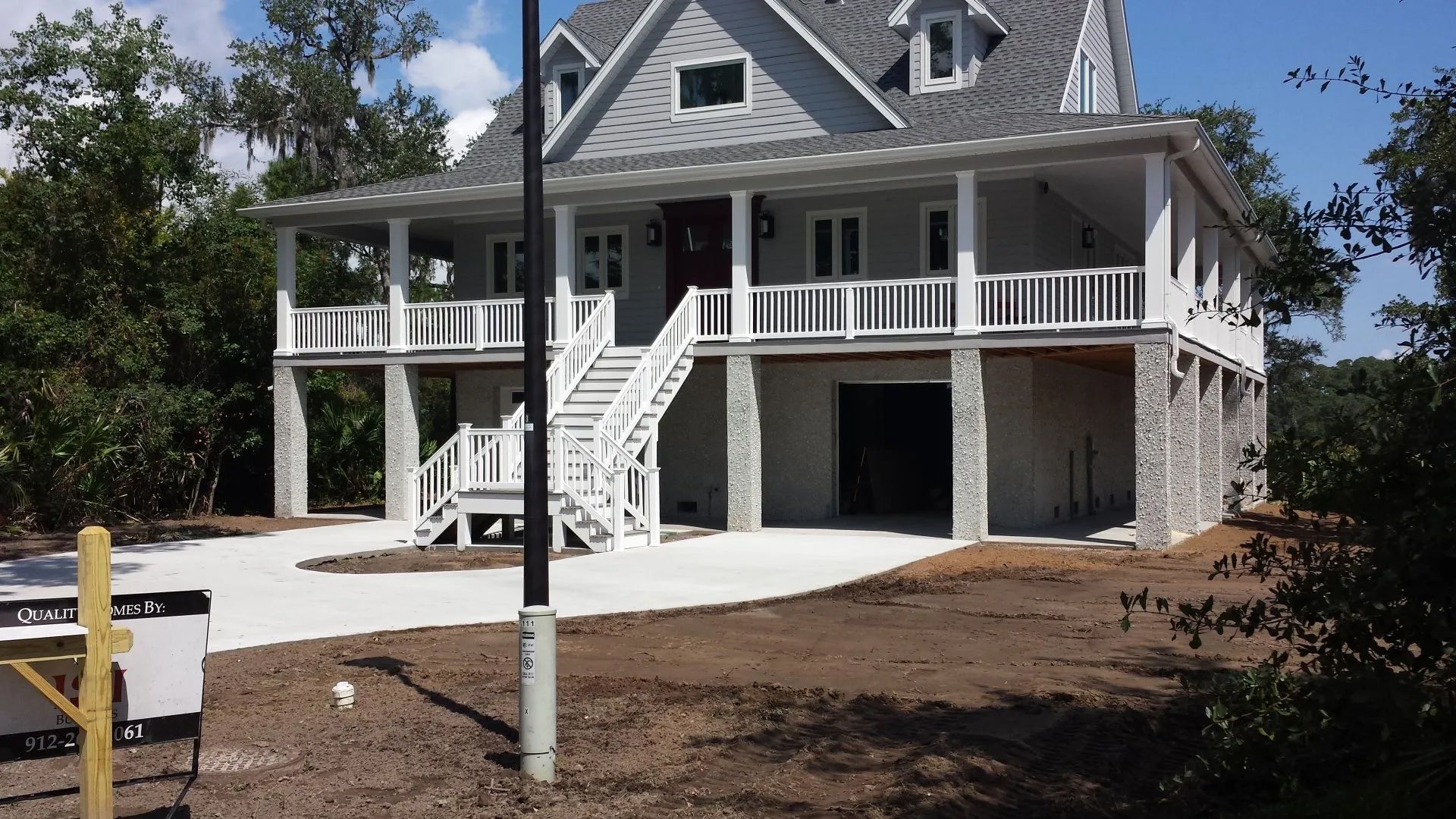 a large house with a lot of porches and stairs