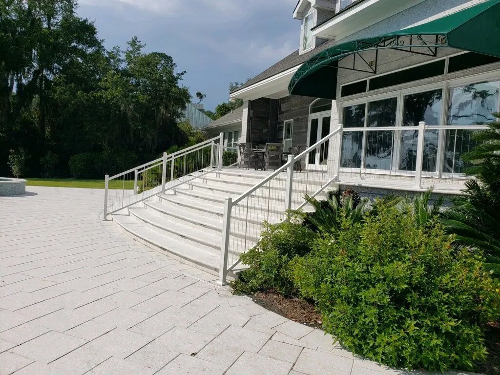 stairs leading up to a building with a green awning
