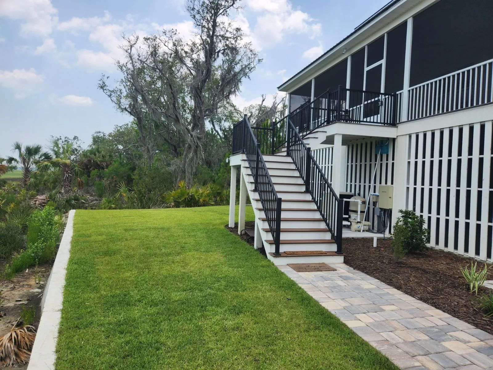 a house with stairs leading up to the second floor