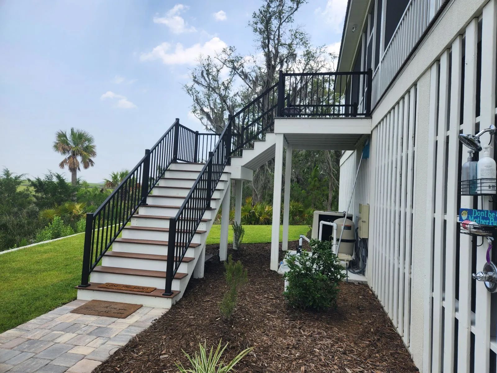 a house with stairs leading up to the second floor
