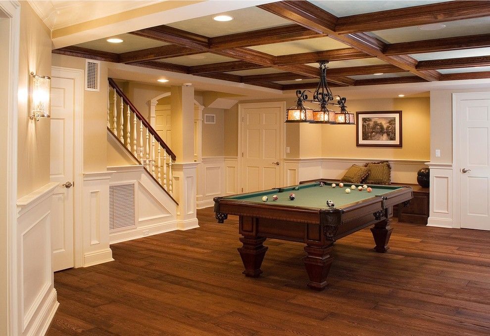 There is a pool table in the middle of the room.
