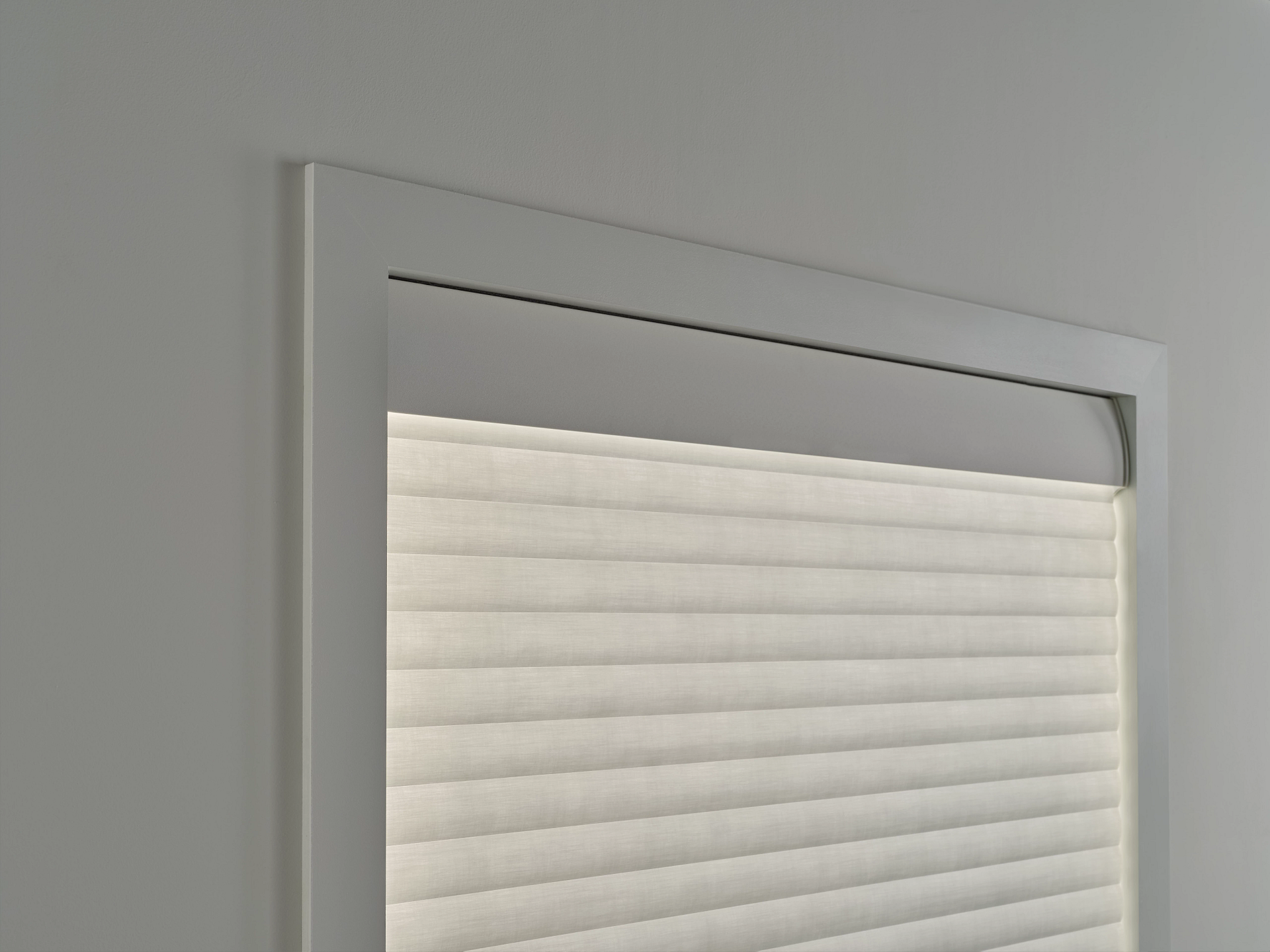 A close up of a window with blinds on it