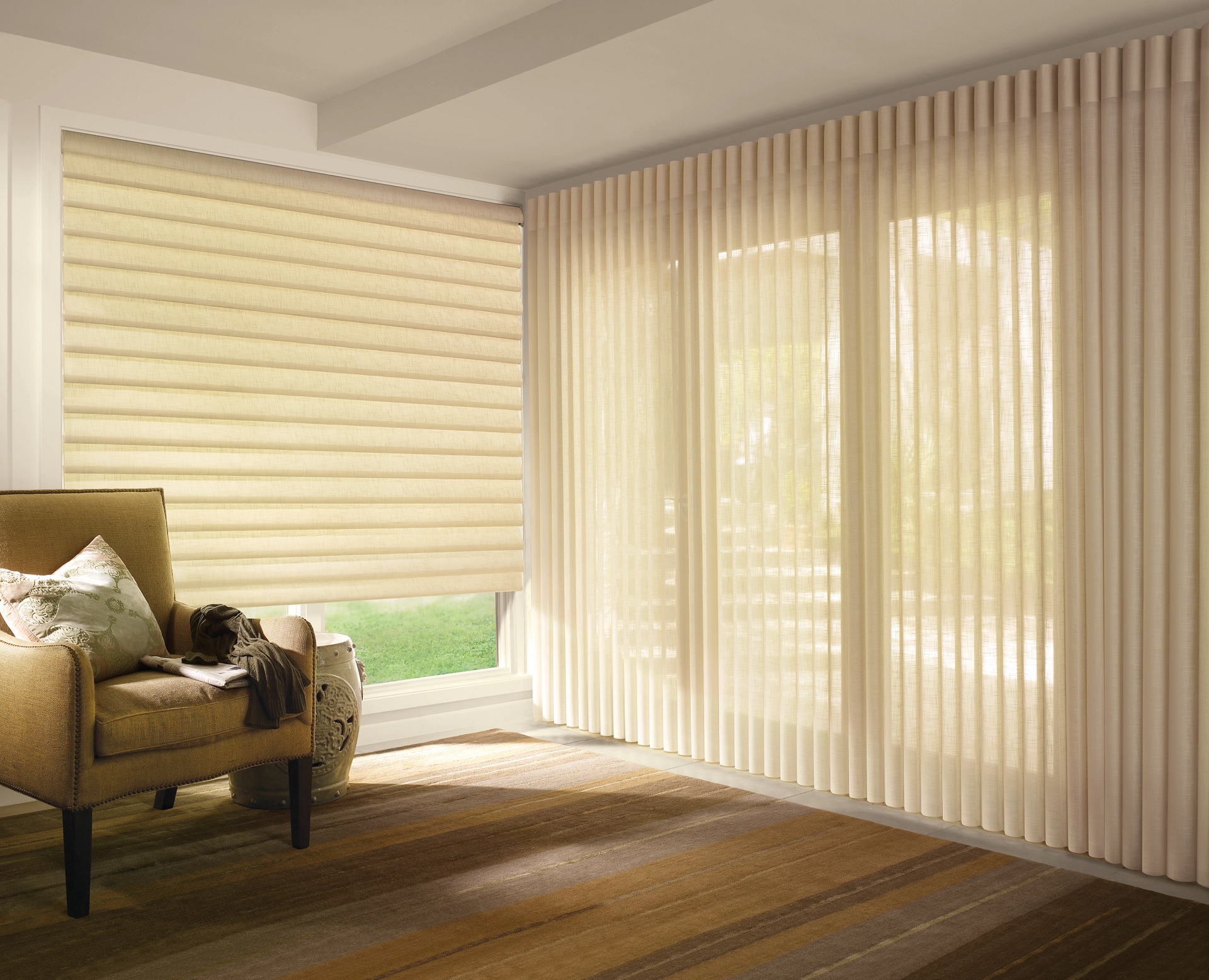 A living room with a chair , blinds and sliding glass doors.