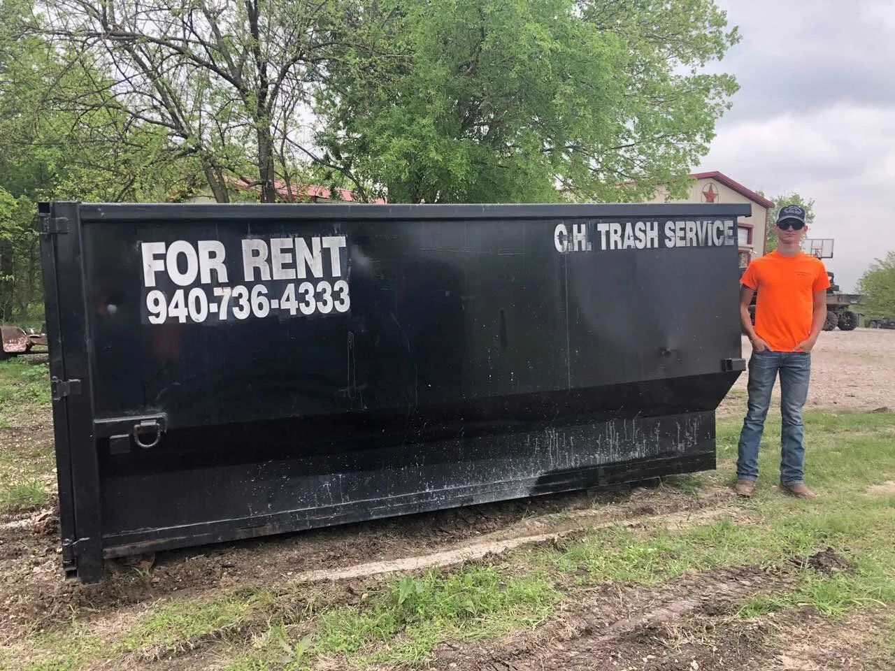 A black dumpster with 