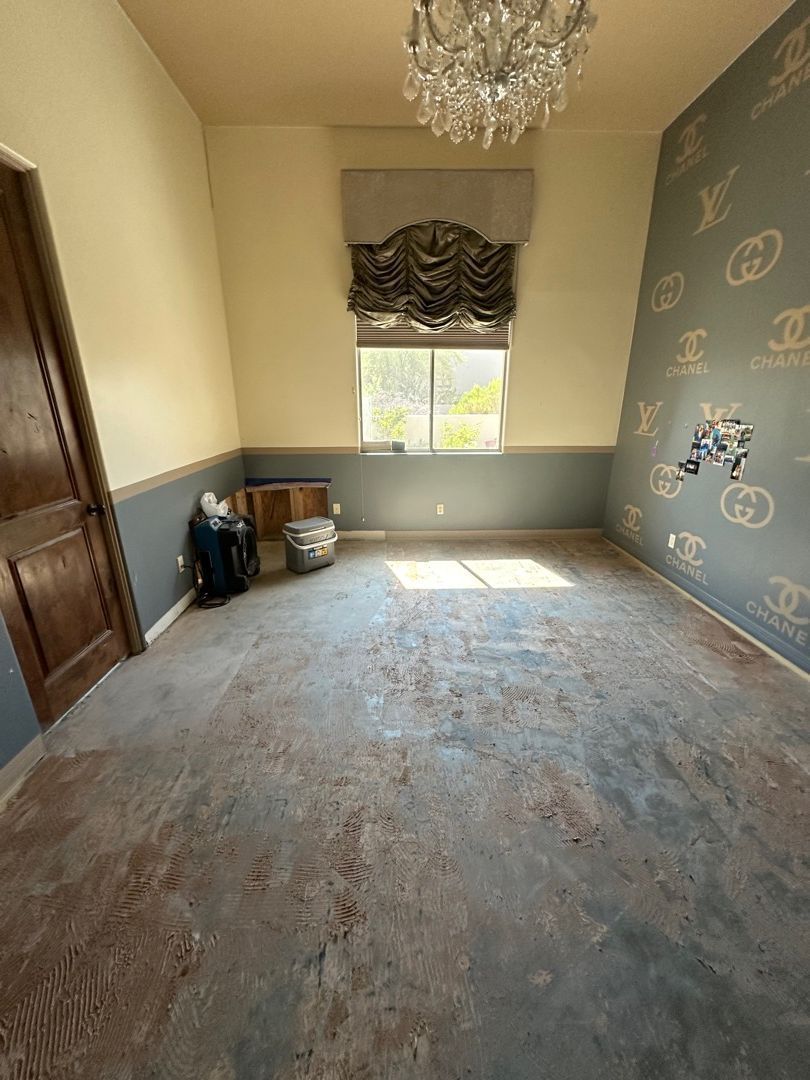 There is a chandelier in the middle of the room.