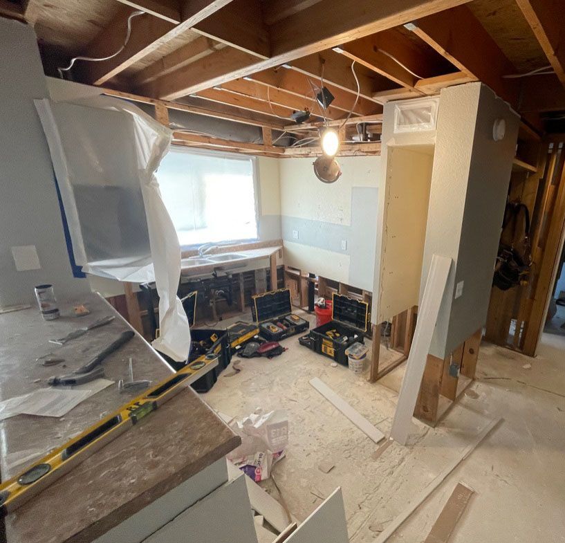 A room that is being remodeled with a lot of tools on the floor.