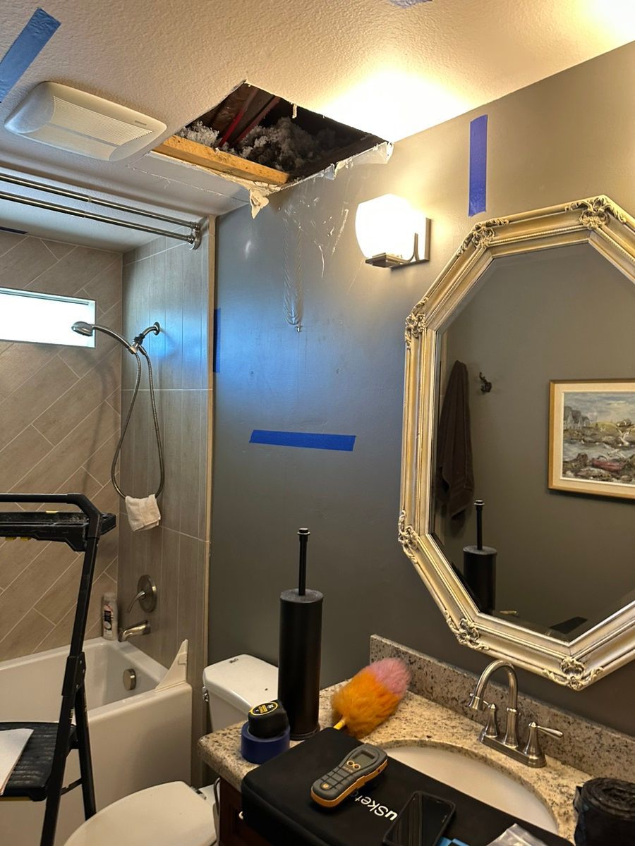 A bathroom with a sink , toilet , and mirror.