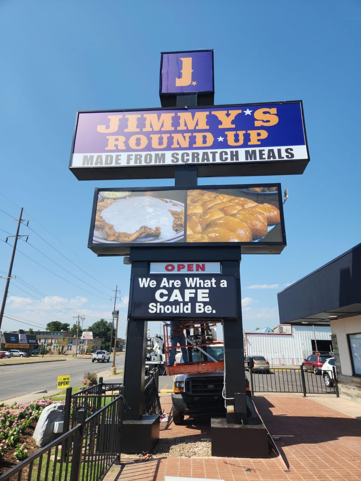 A sign for jimmy 's round up made from scratch meals
