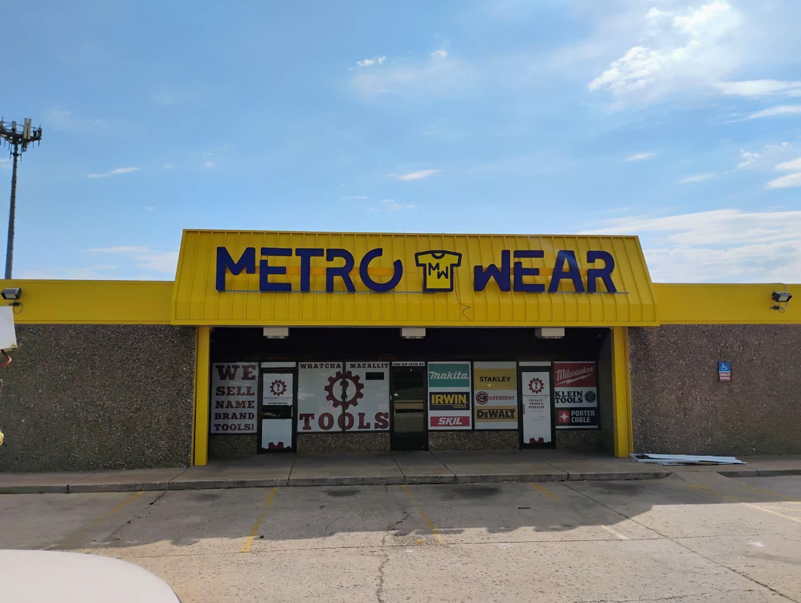 A yellow building with the word metro wear on it