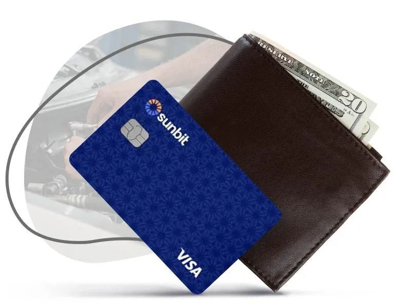 Blue Visa card and brown wallet on a white background