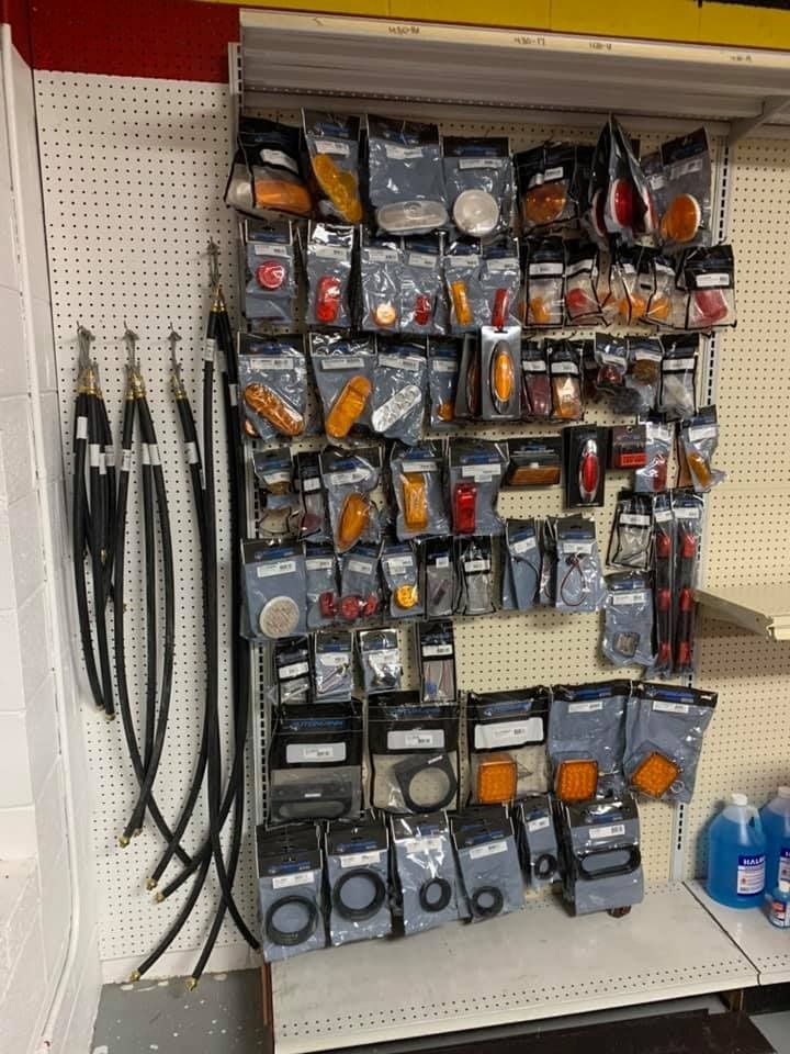 A store shelf filled with lots of different types of lights.