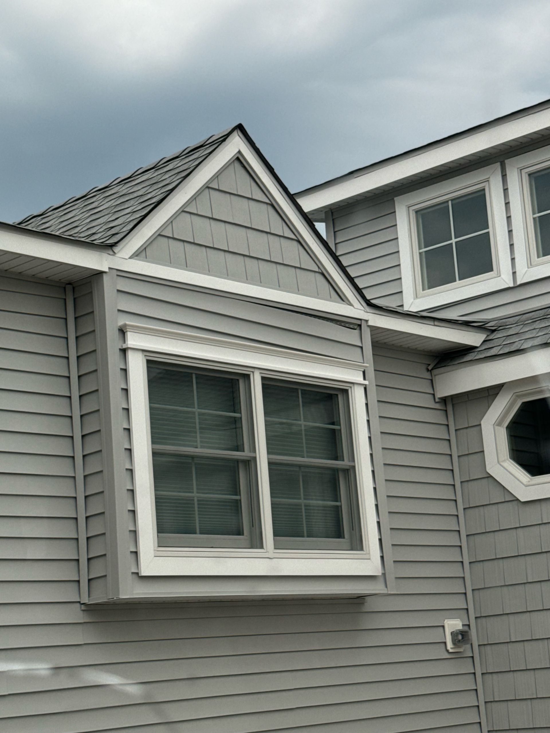 A house with a large window on the side of it