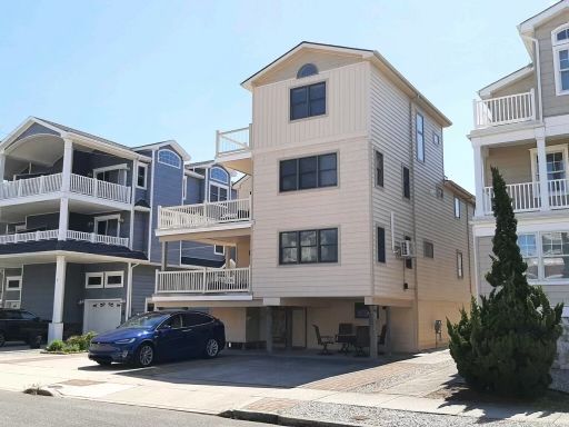 A house with a car parked in front of it