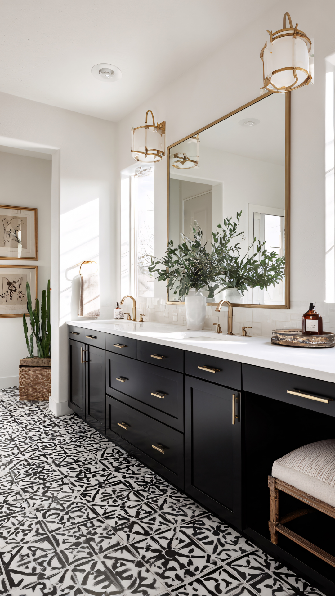 Black and white bathroom with patterned floor, dark cabinets, and gold accents.