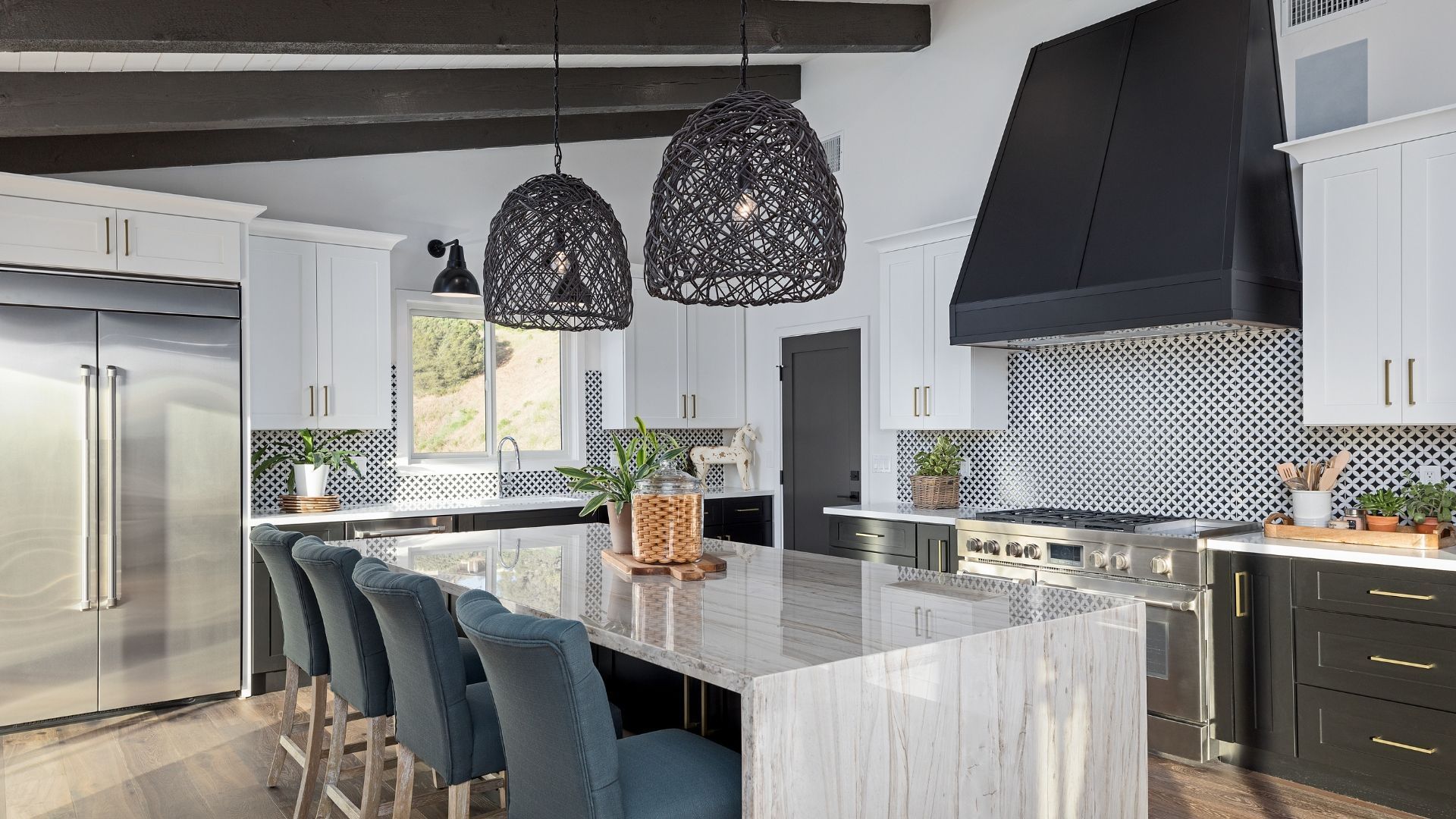 Modern kitchen with a black range hood and white cabinets