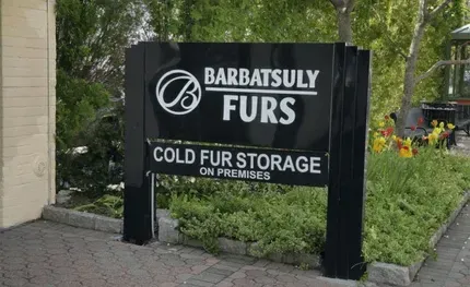 Sign for Barbatsuly Furs, black with white text and logo. It reads Cold Fur Storage on Premises.
