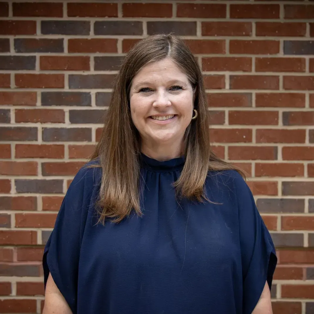 Photo of {{Team Member Name}}