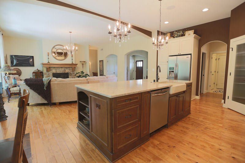 A kitchen with a large island in the middle of the room.