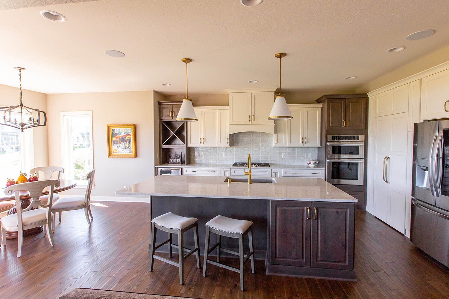 There is a large island in the middle of the kitchen.