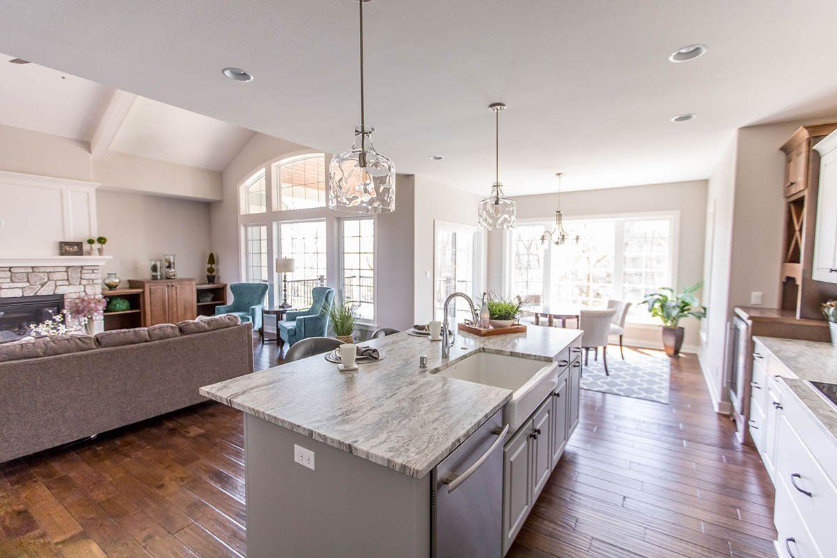 A kitchen with a large island in the middle of the room.