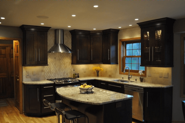 A kitchen with stainless steel appliances and granite counter tops