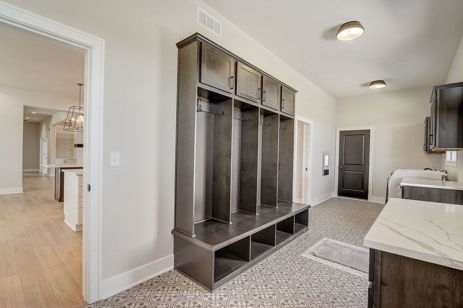 A large cabinet in the laundry room.