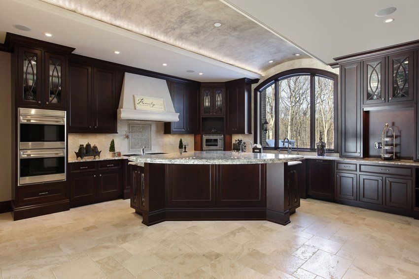 A large kitchen with a large island in the middle