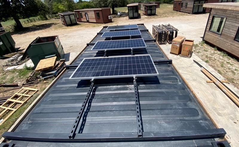 a black container with solar panels on top of it