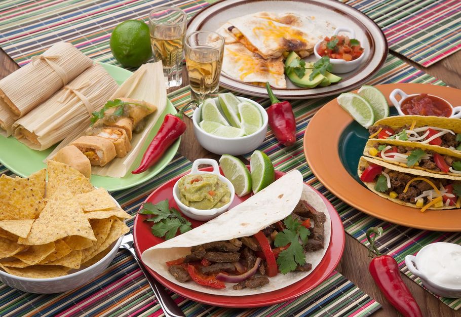 There are many different types of mexican food on the table.
