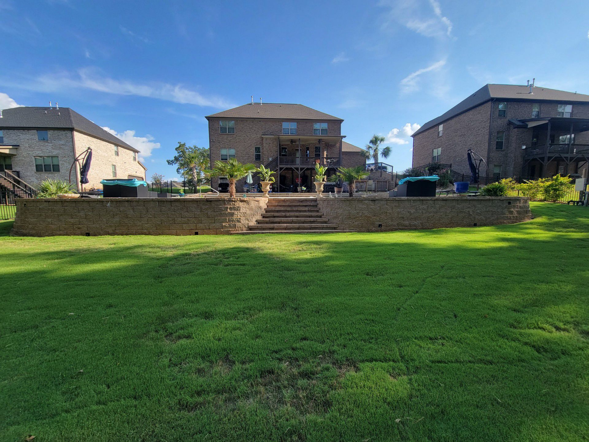 A large house with a large lawn in front of it.