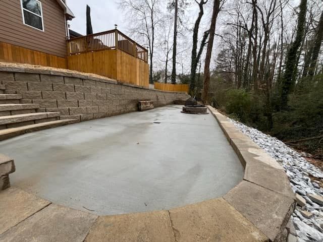 A swimming pool is being built in the backyard of a house.