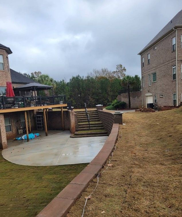 A house with a deck and stairs in front of it.