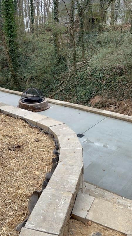 A fire pit is sitting on the side of a road.