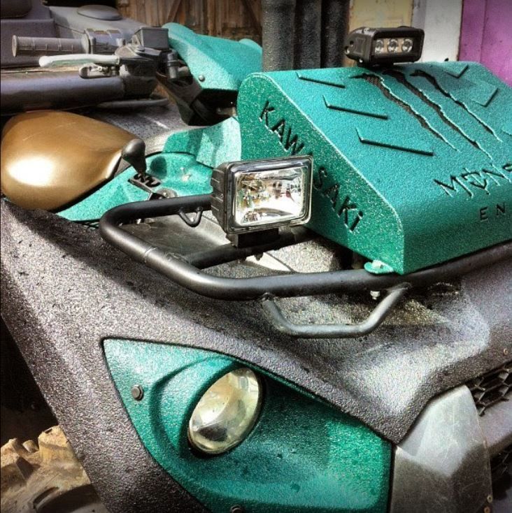 A kawasaki monster truck with a green hood