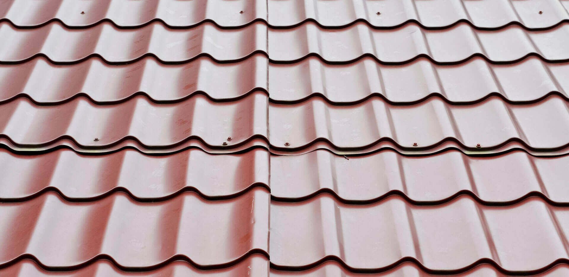 A close up of a red tile roof