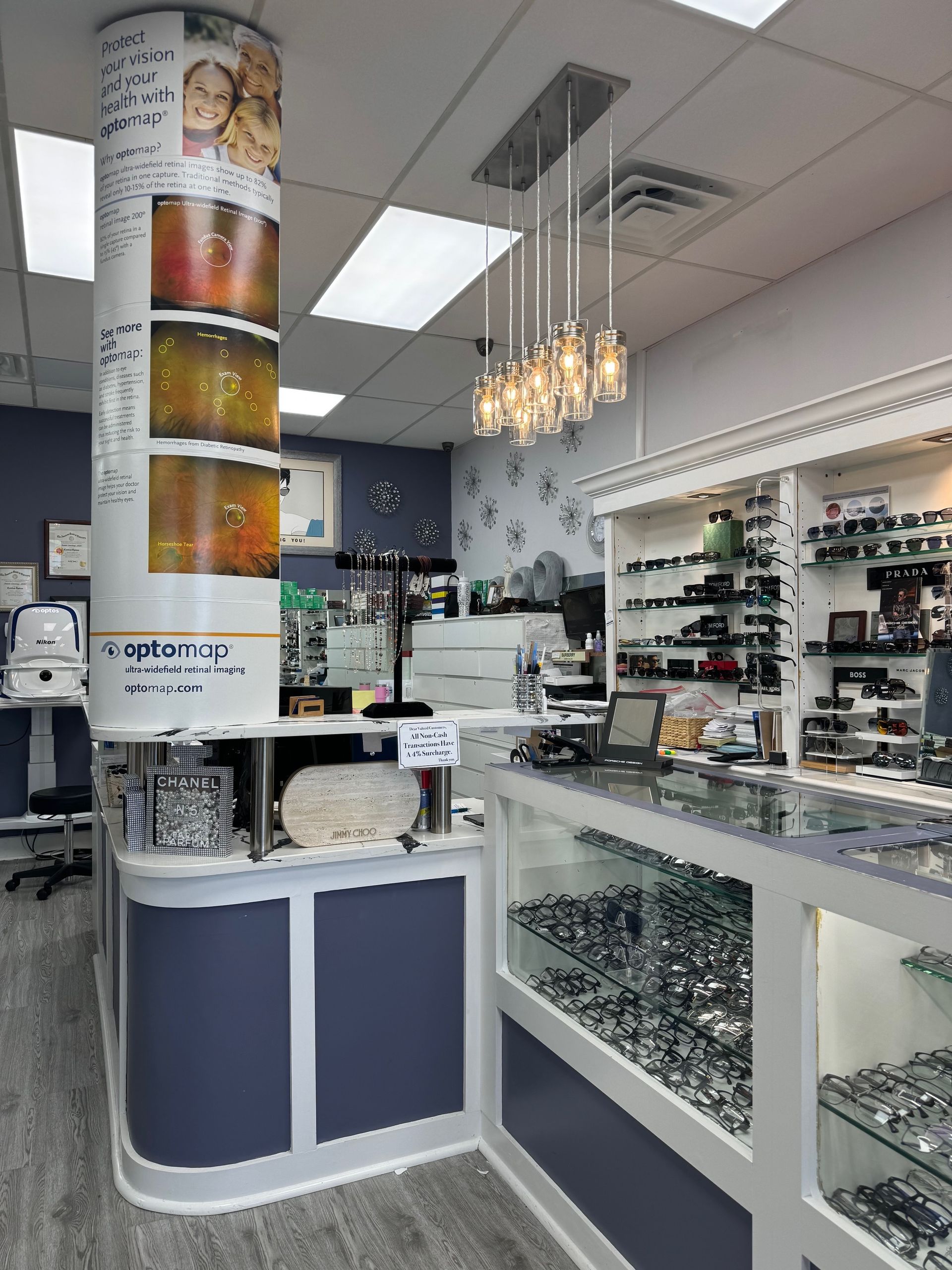 A store filled with lots of glasses and a counter.