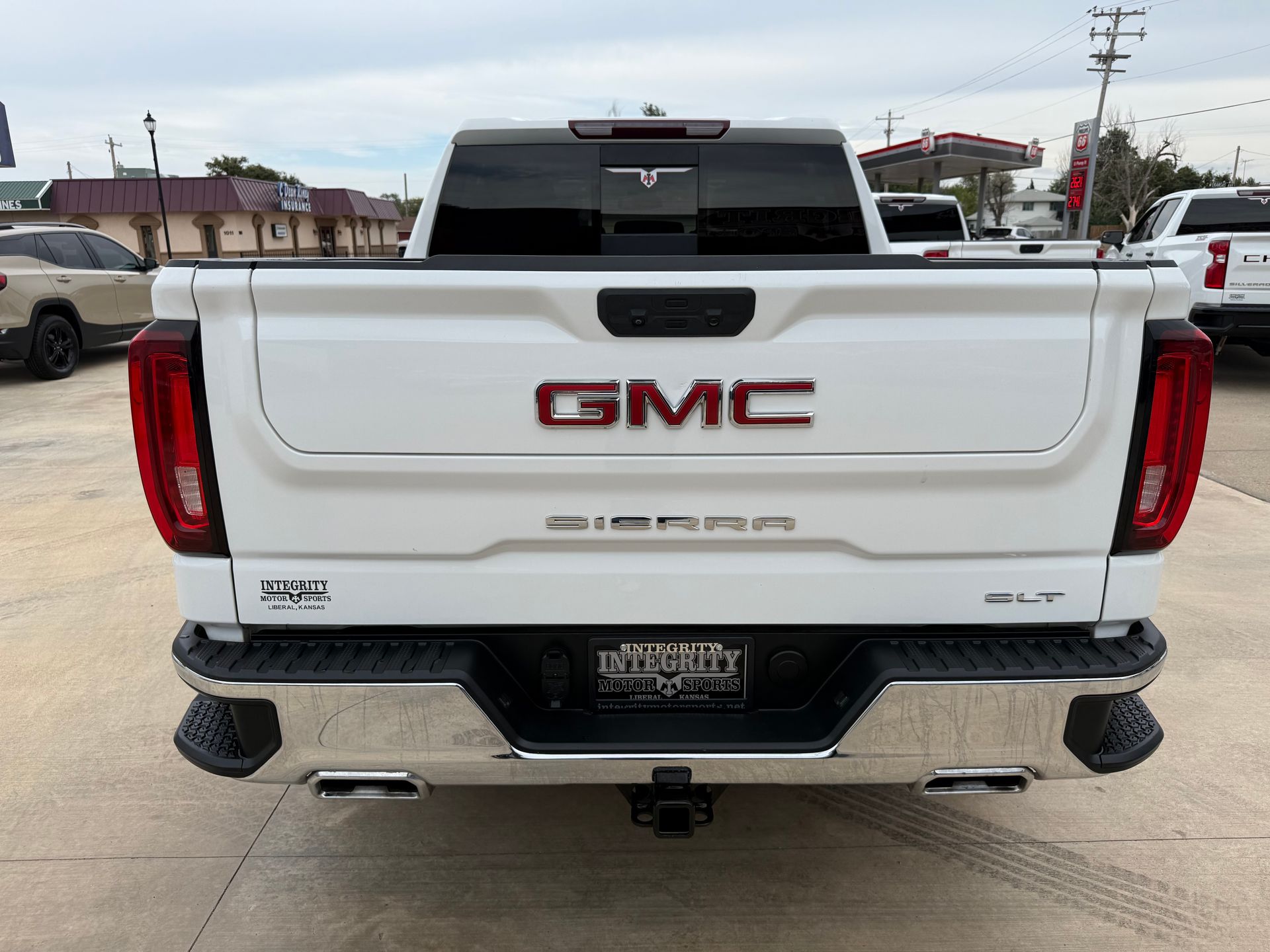 White GMC Sierra pickup truck from the rear, with chrome bumper, 