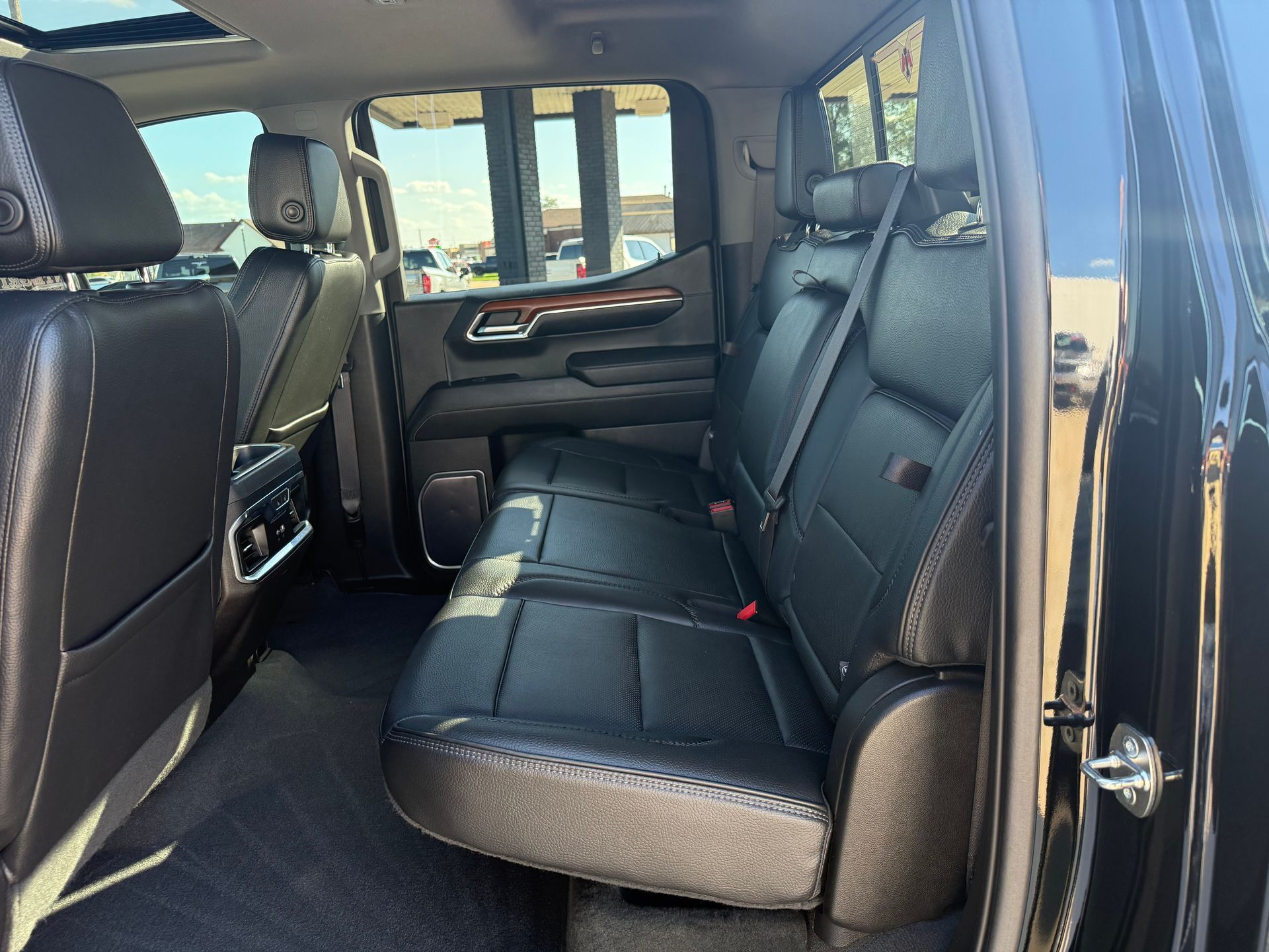 Black truck interior with leather seats.