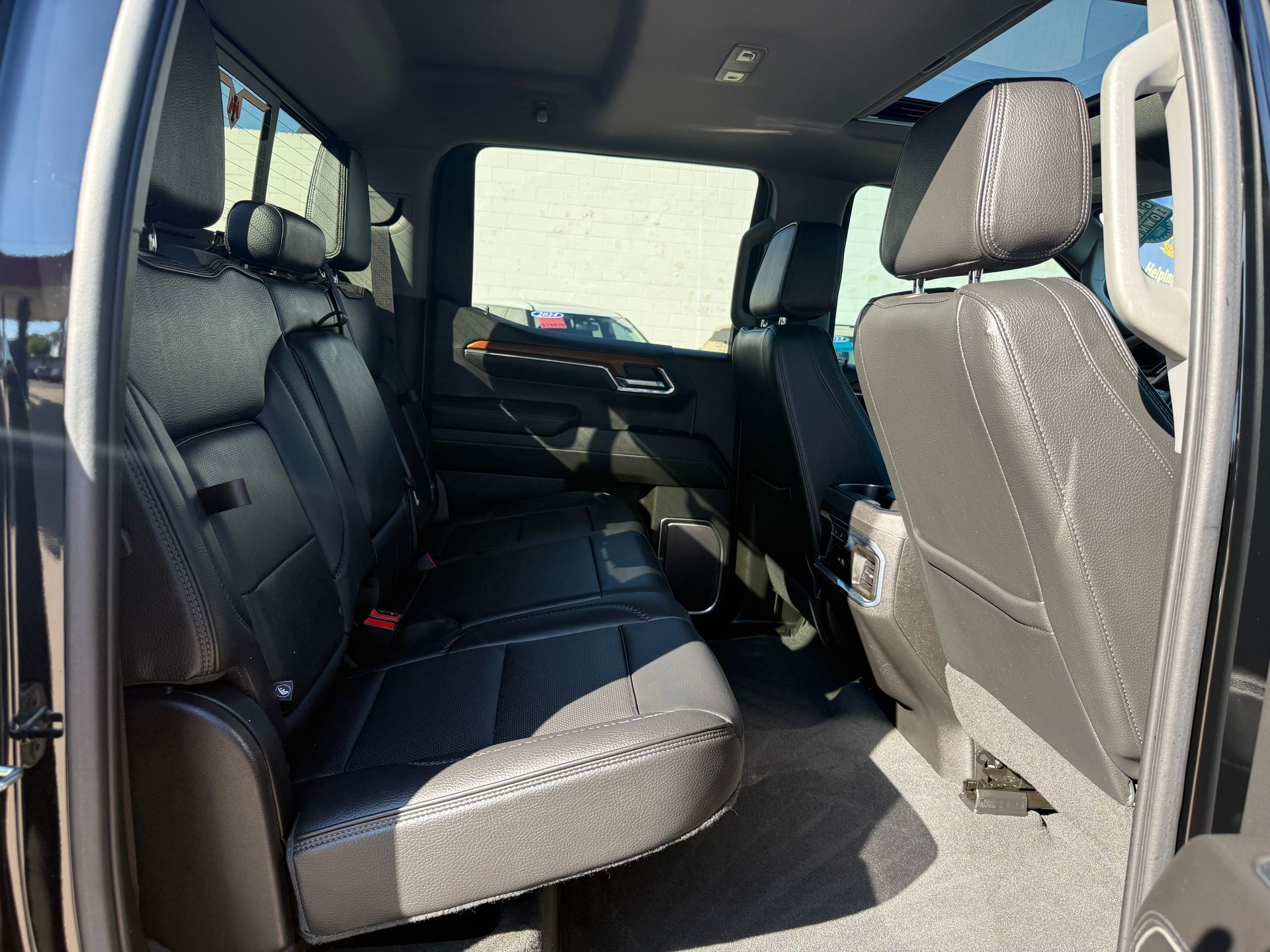 Black truck interior with rear seats.