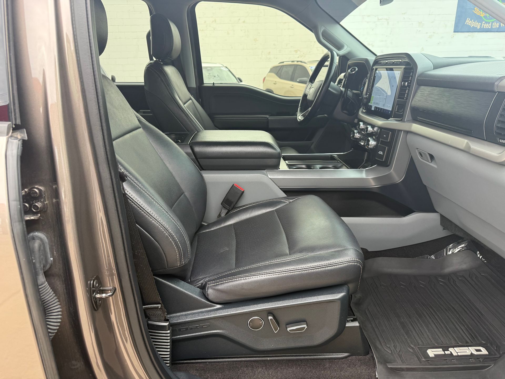 Tan Ford F-150 interior with black leather seats. 