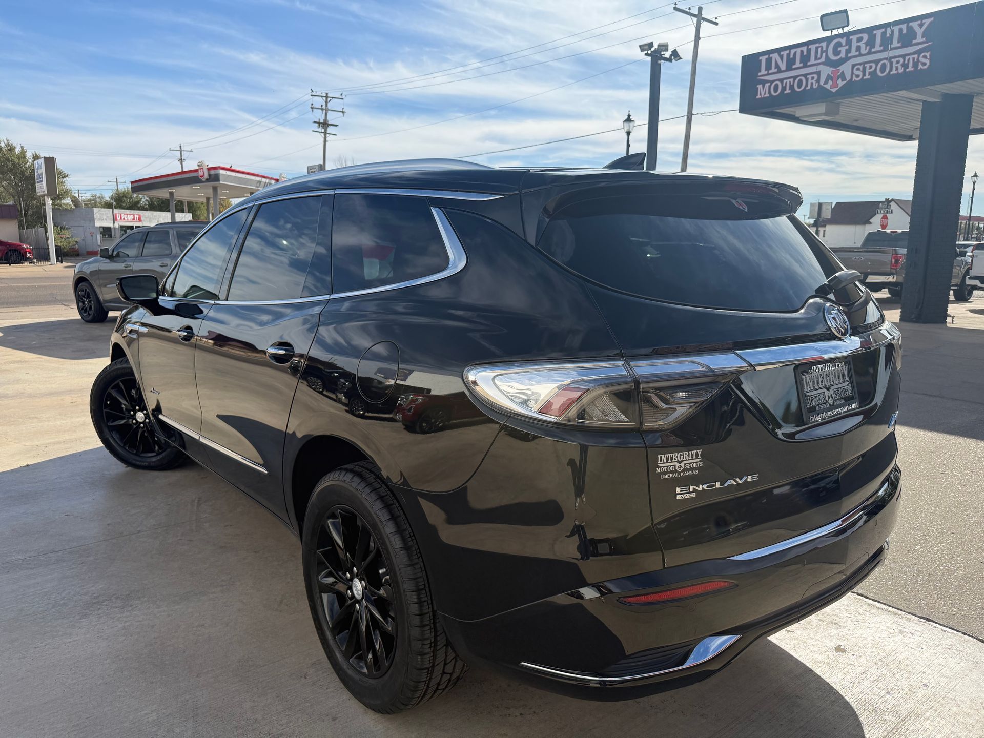 Black Buick Enclave SUV parked outside