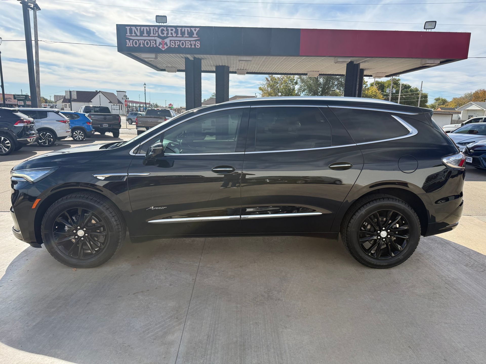 Black SUV parked at Integrity Motor Sports dealership.