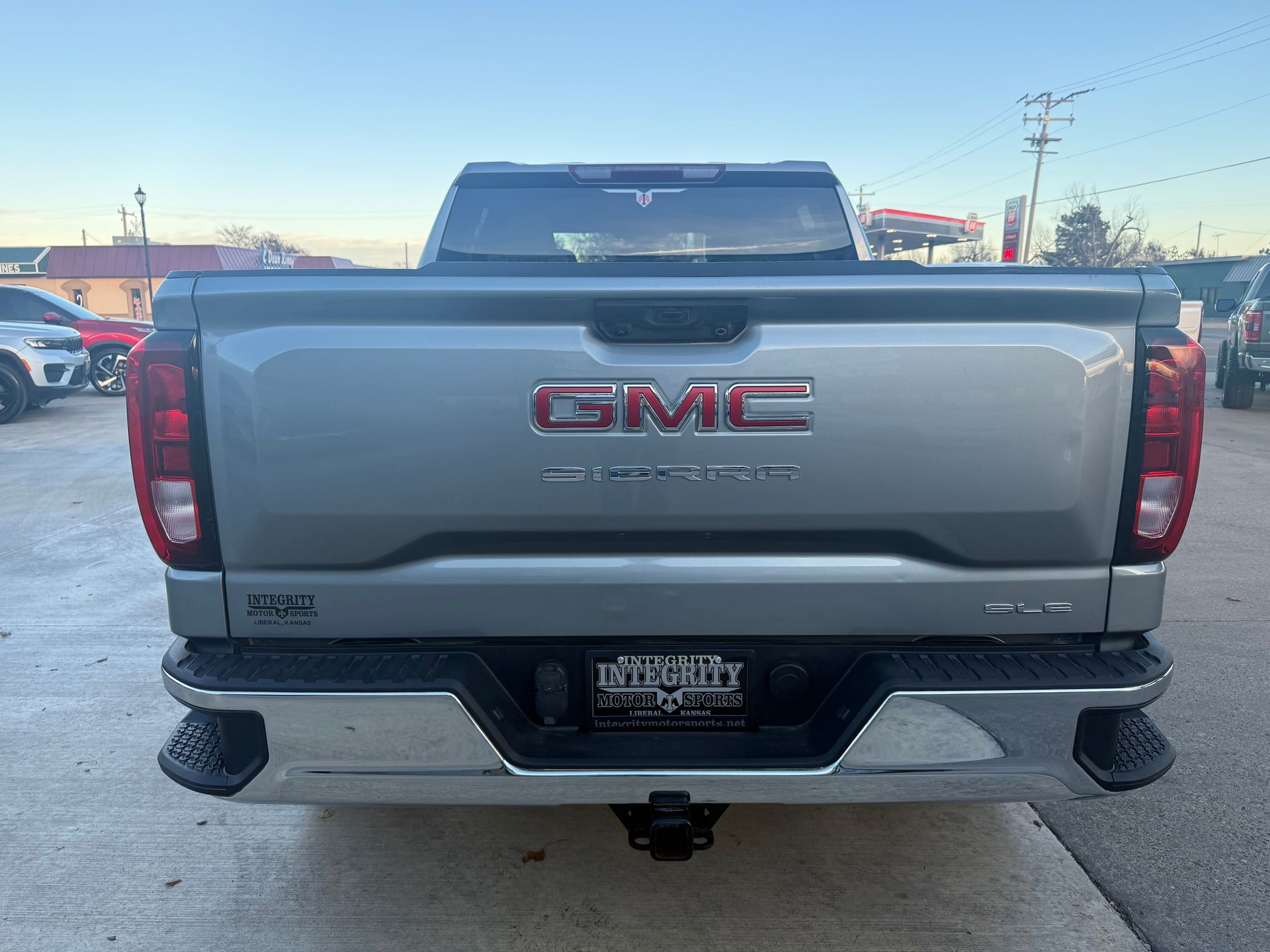 Rear view of a silver GMC truck with