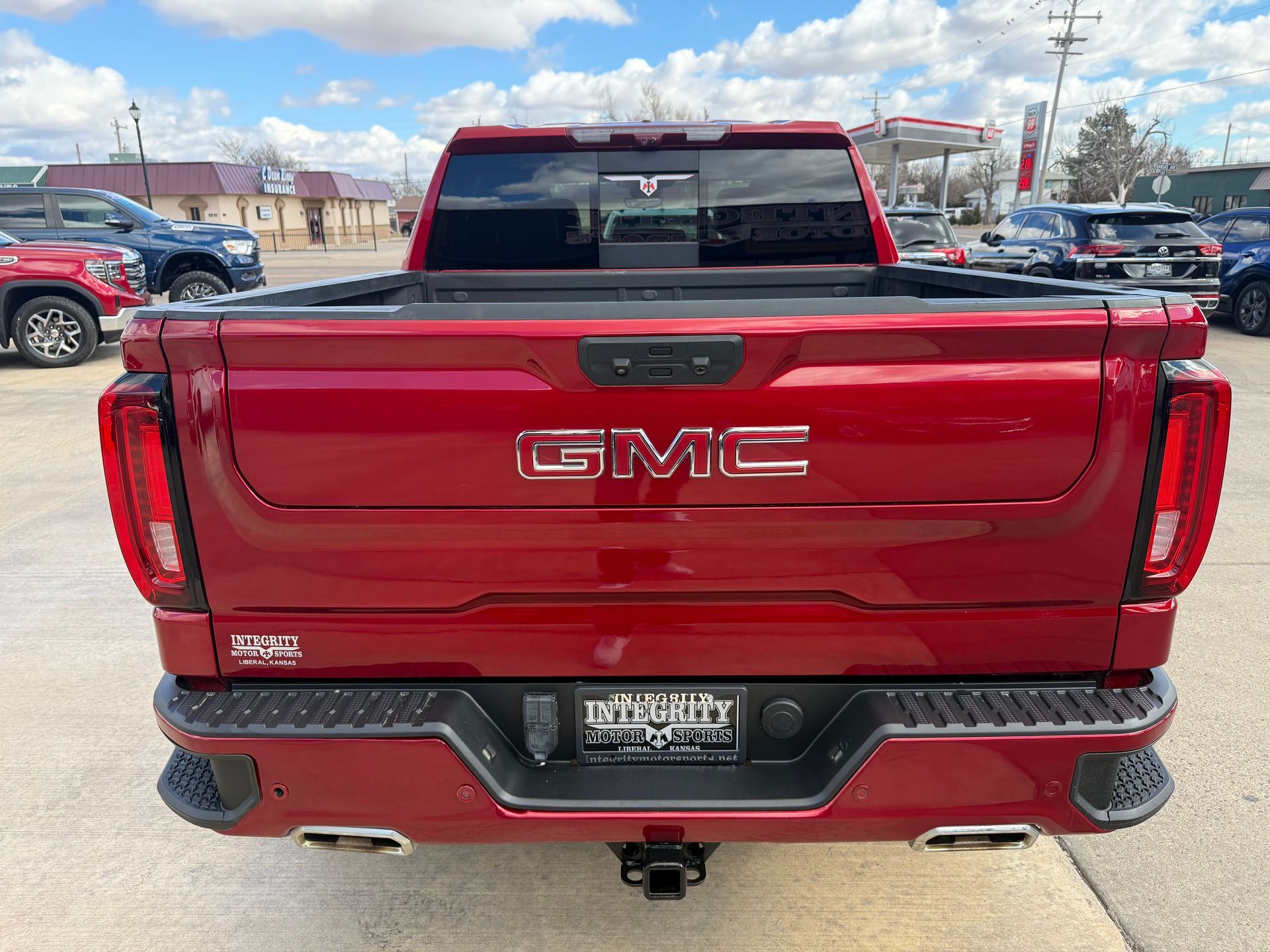 Rear view of a red GMC truck with