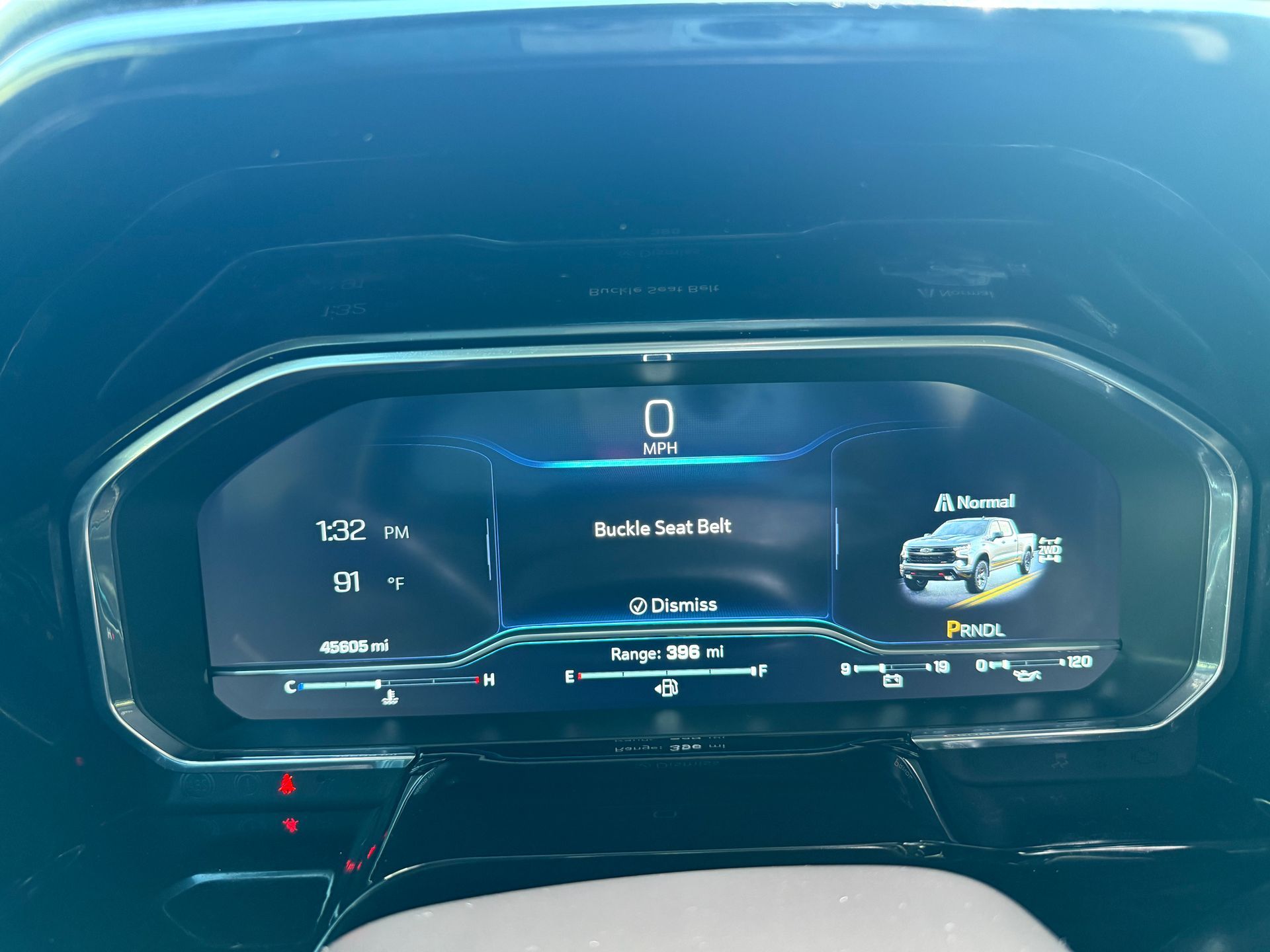 Dashboard of a vehicle displaying speed, gear, and fuel range.