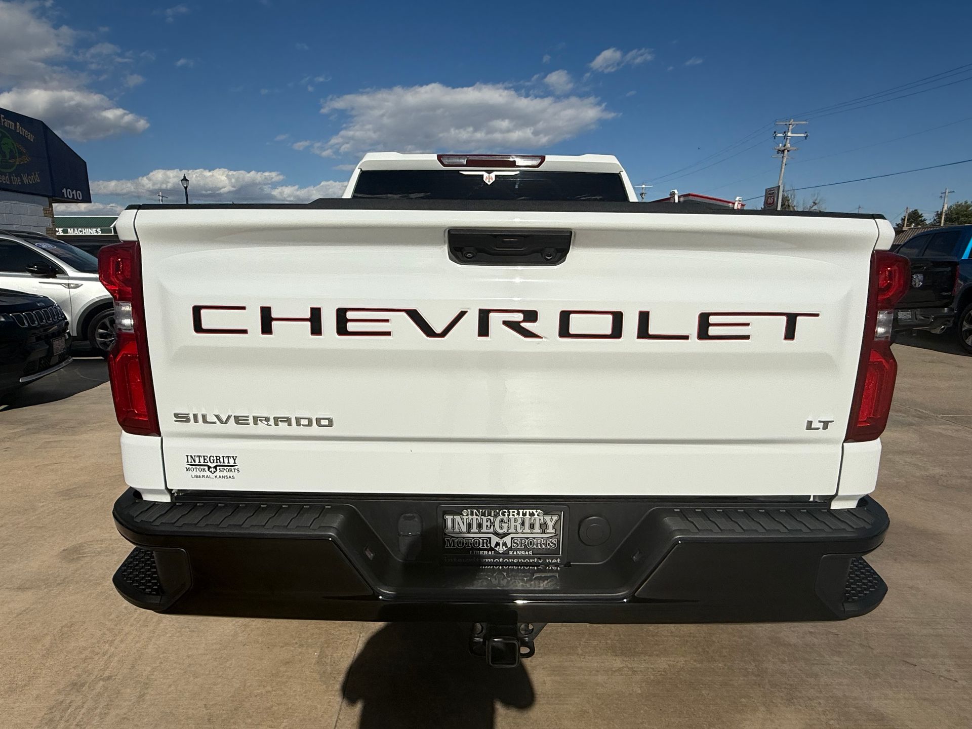 White Chevrolet Silverado truck, rear view, with 