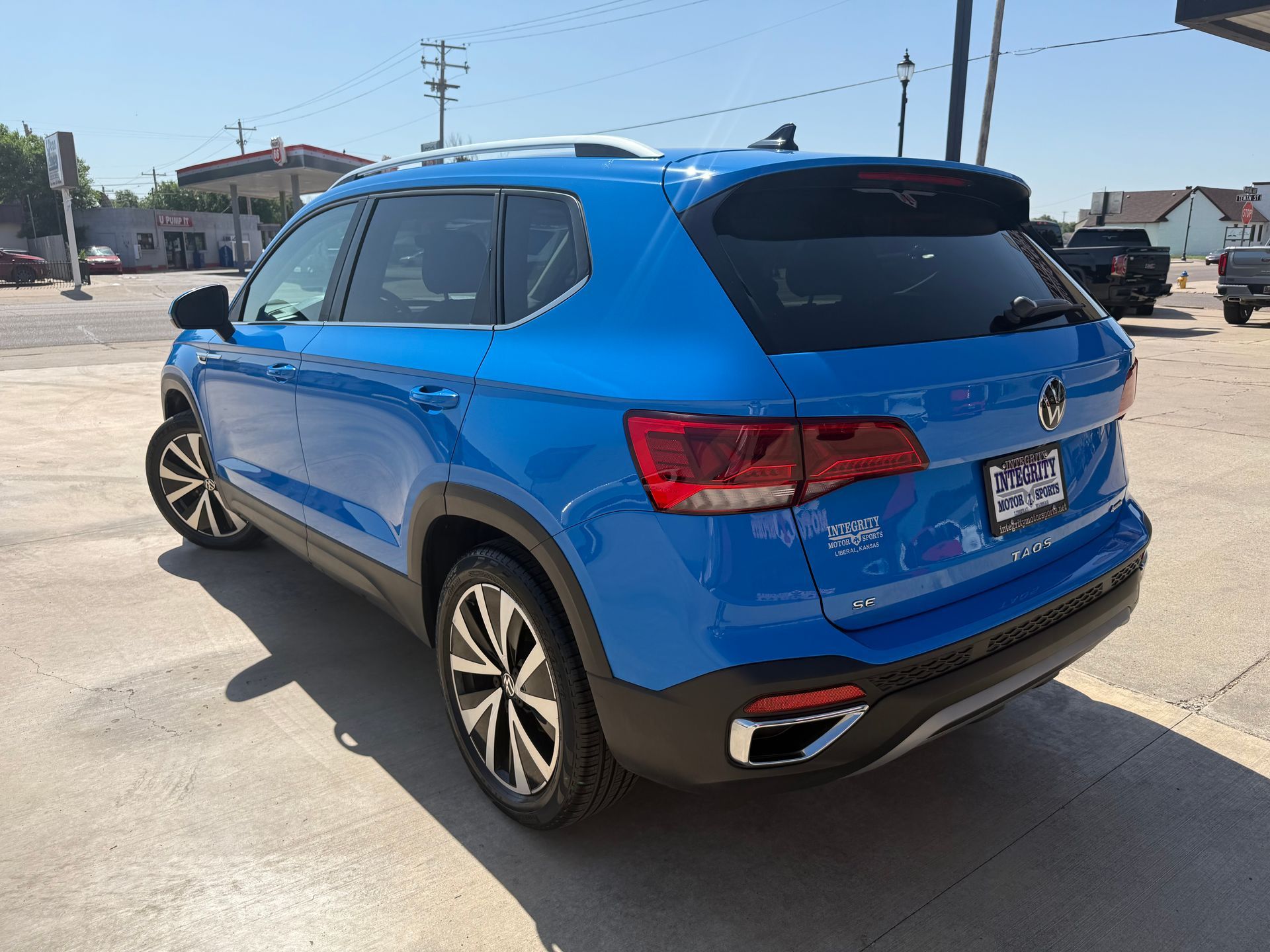 Blue Volkswagen Taos SUV parked on a sunny day.