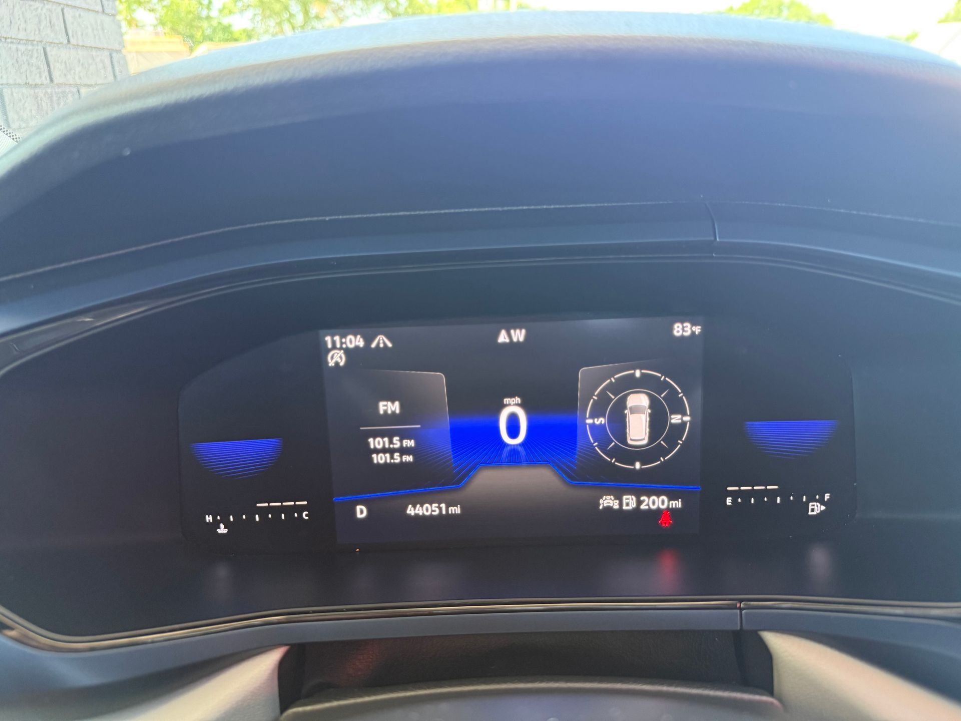 Car dashboard displaying vehicle information, speed at 0, and other driving data.
