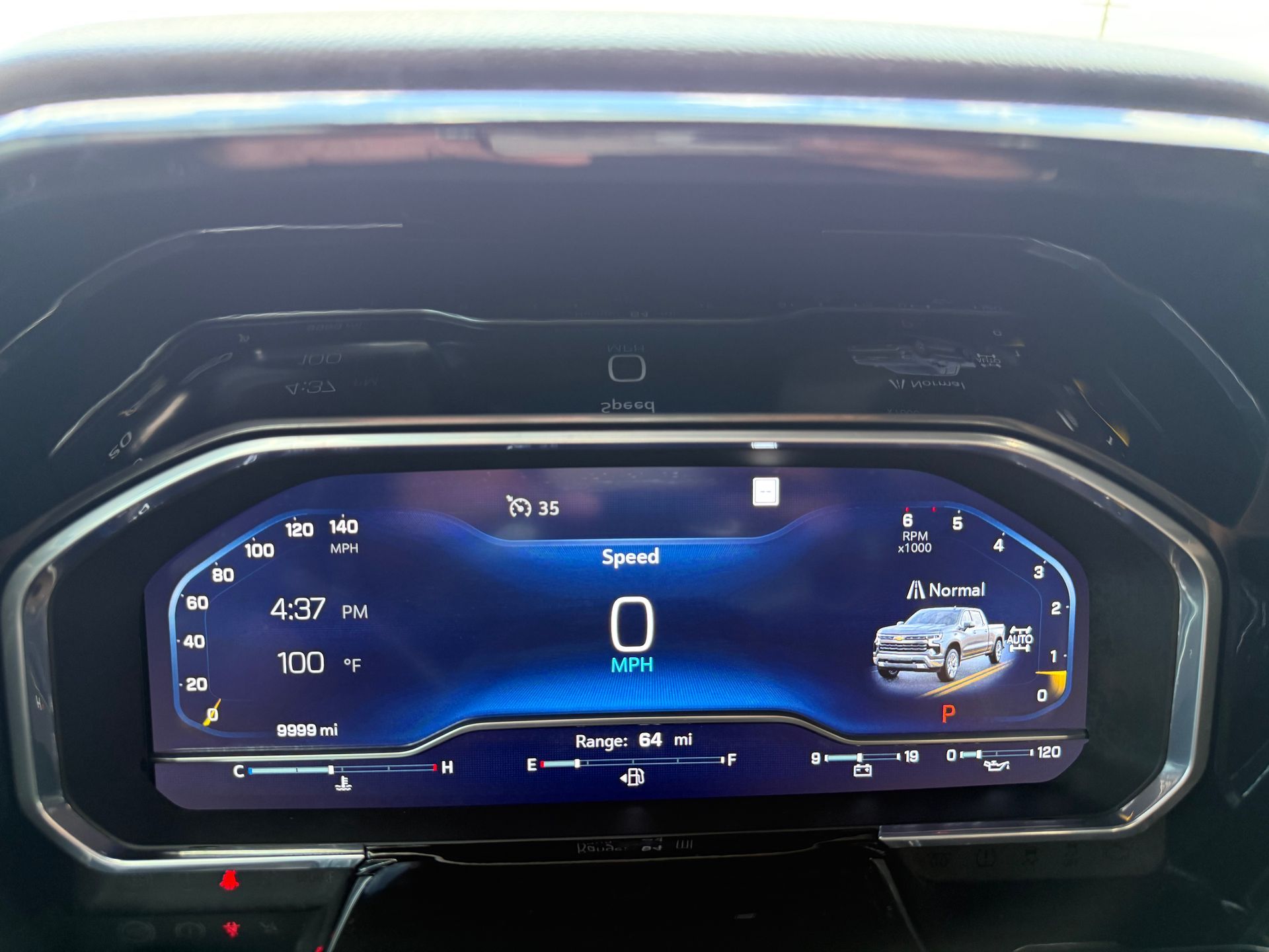 Digital car dashboard showing speed at zero, with vehicle illustration.